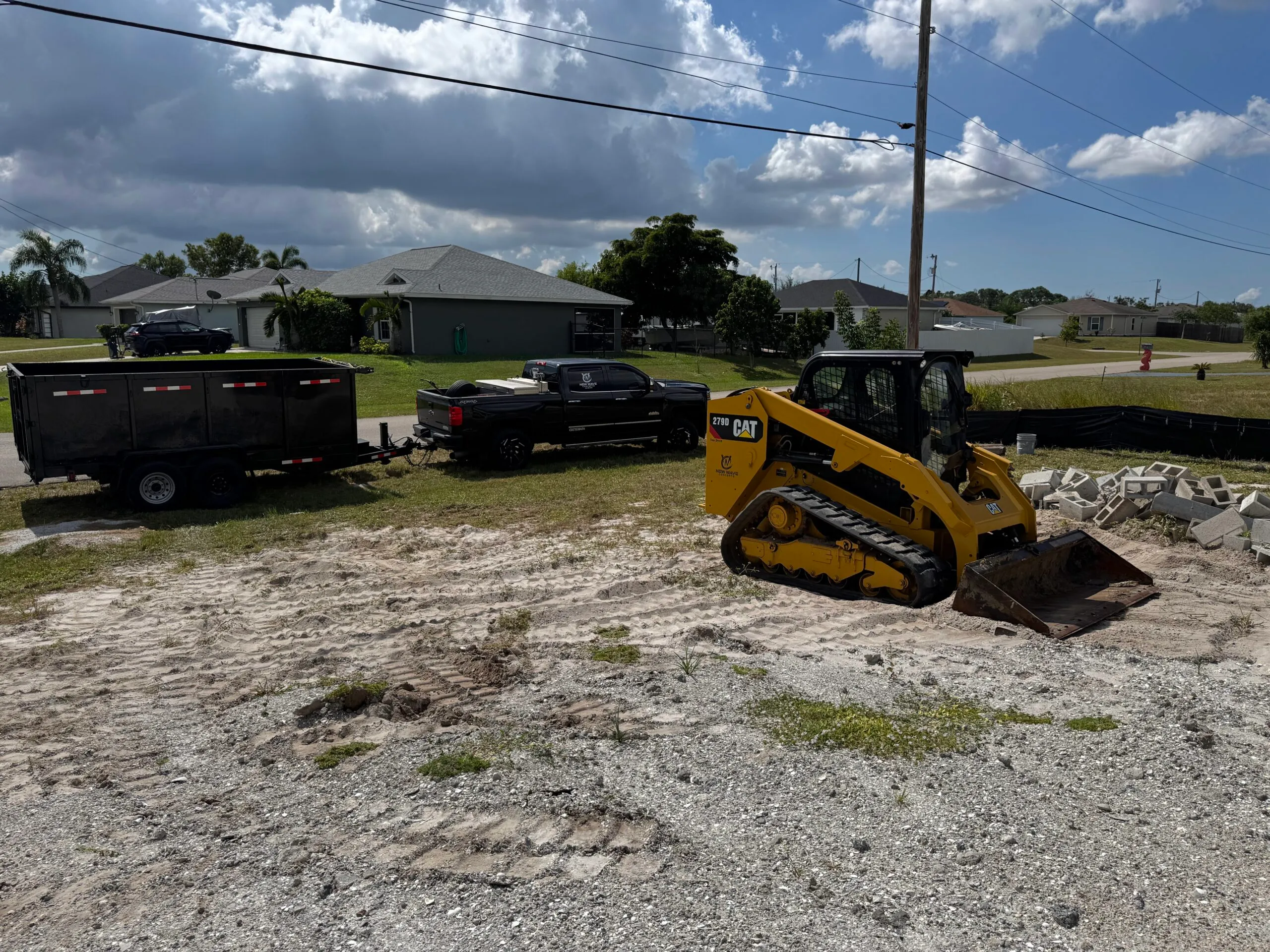 Skid steer clearing and prepping a lot in Cape Coral, FL